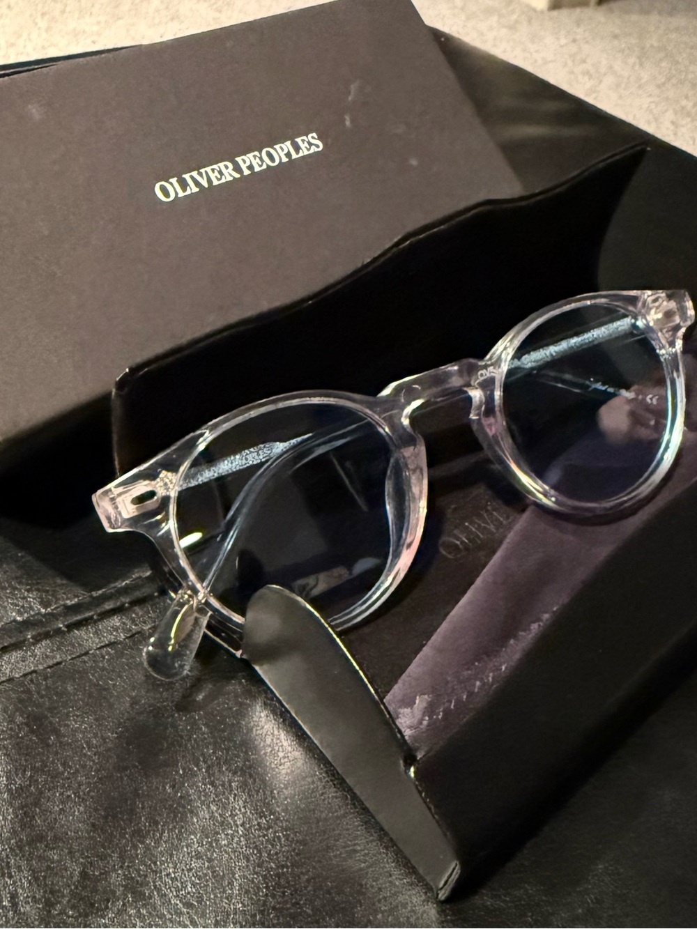 Oliver Peoples Clear Frame Sunglasses with Blue Lenses